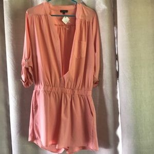 Boutique romper with tags still on.